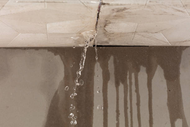 Professional Flood Damage Cleanup technician working in Berlin, NH